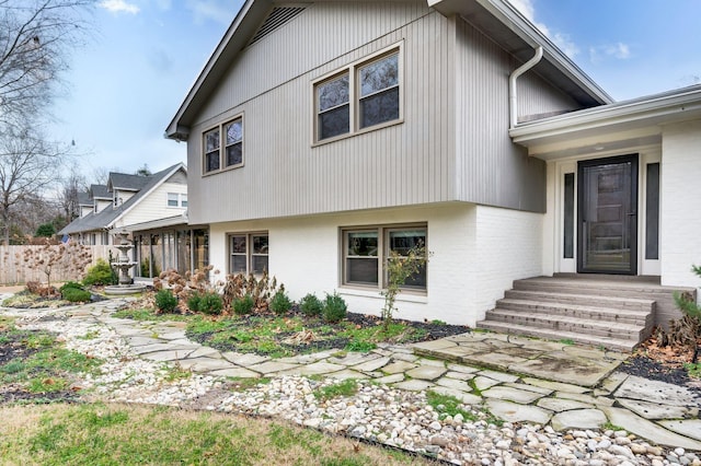 exterior space with brick siding