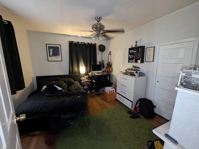 bedroom with a ceiling fan and wood finished floors