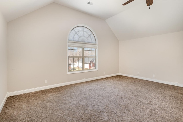 additional living space with visible vents, a ceiling fan, baseboards, carpet flooring, and lofted ceiling