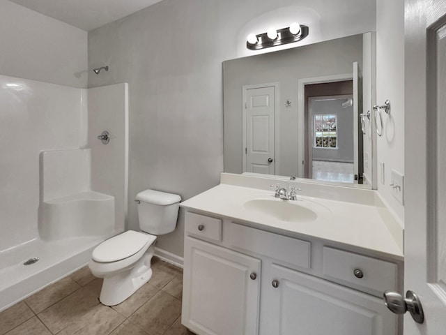 full bath featuring baseboards, toilet, tile patterned floors, vanity, and a shower