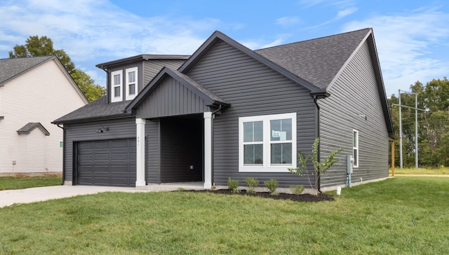 view of front of home with a front yard, an attached garage, concrete driveway, and roof with shingles