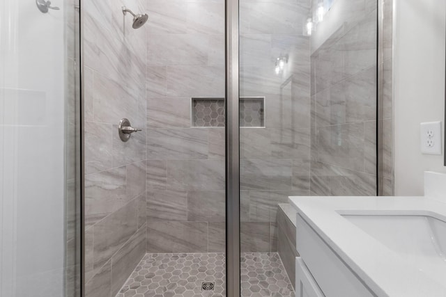 bathroom featuring a stall shower and vanity