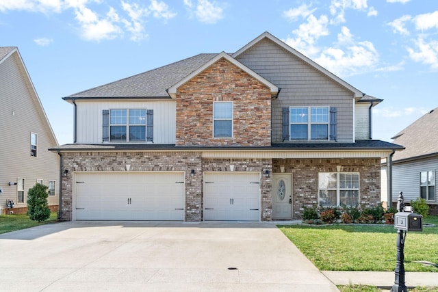 view of front of house with brick siding, board and batten siding, a front yard, a garage, and driveway