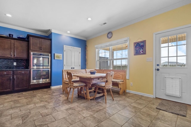 dining room featuring recessed lighting, baseboards, visible vents, and ornamental molding