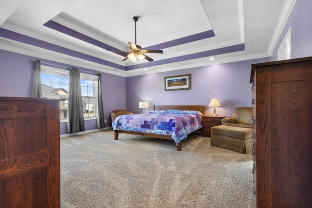 bedroom featuring a raised ceiling, carpet floors, ceiling fan, and crown molding