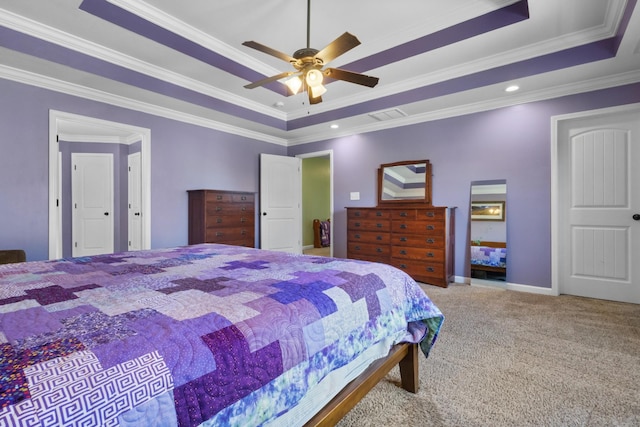 carpeted bedroom featuring visible vents, a raised ceiling, crown molding, baseboards, and ceiling fan