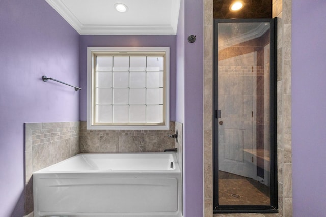 full bath featuring a garden tub, crown molding, and a stall shower