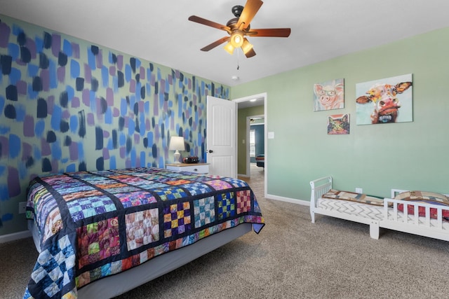 carpeted bedroom featuring ceiling fan, wallpapered walls, and baseboards