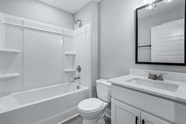 full bathroom featuring shower / bath combination, toilet, and vanity