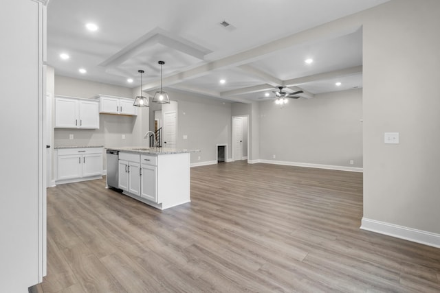 kitchen featuring light wood-type flooring, baseboards, stainless steel dishwasher, and ceiling fan