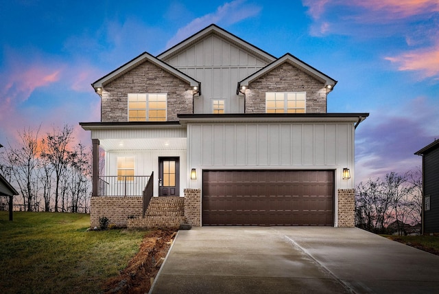 view of front of house featuring a front lawn, covered porch, board and batten siding, concrete driveway, and a garage