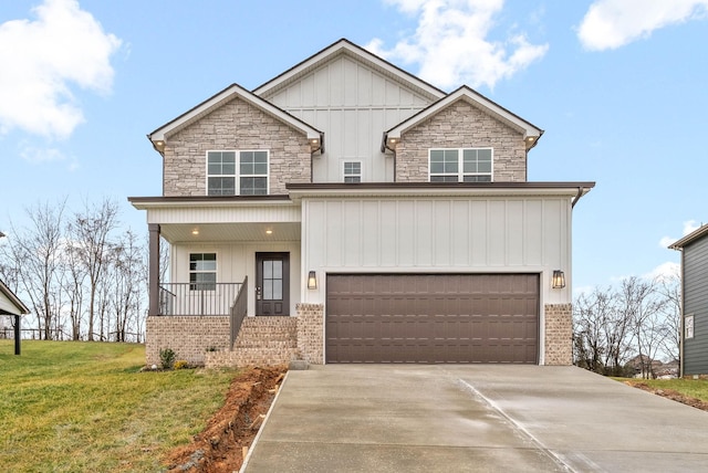 craftsman house with a porch, a garage, board and batten siding, and driveway