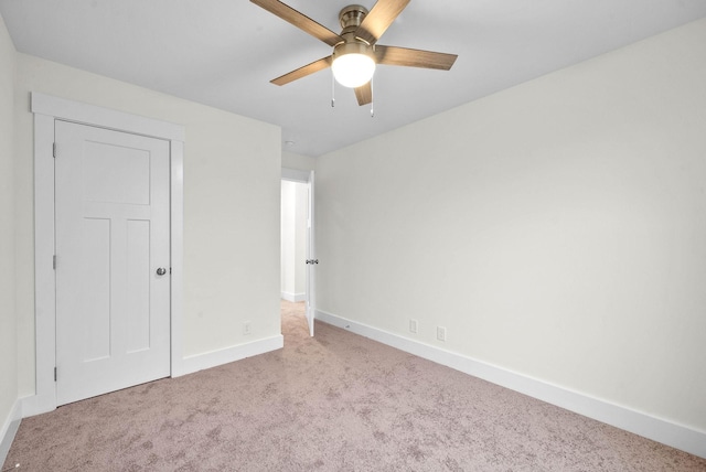 unfurnished bedroom with carpet flooring, ceiling fan, and baseboards