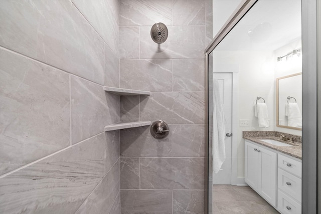 bathroom featuring vanity and a tile shower