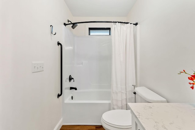 full bath with vanity, shower / tub combo, toilet, and wood finished floors