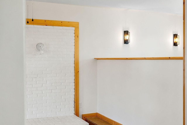 bathroom featuring baseboards and tiled shower