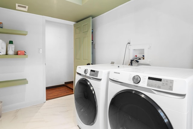 laundry room with visible vents, baseboards, laundry area, separate washer and dryer, and marble finish floor