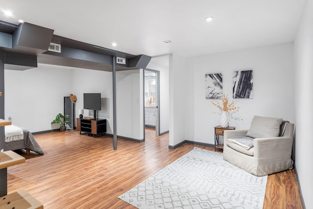 sitting room with visible vents, recessed lighting, baseboards, and wood finished floors