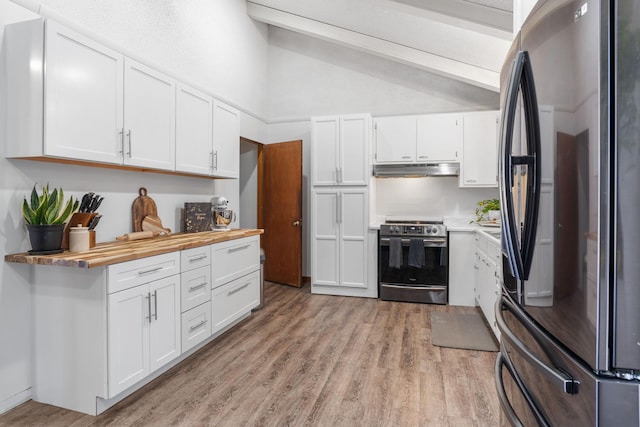 kitchen with light wood-style flooring, vaulted ceiling with beams, white cabinets, under cabinet range hood, and appliances with stainless steel finishes