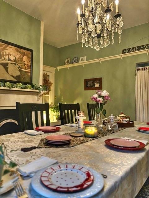 dining space featuring a notable chandelier