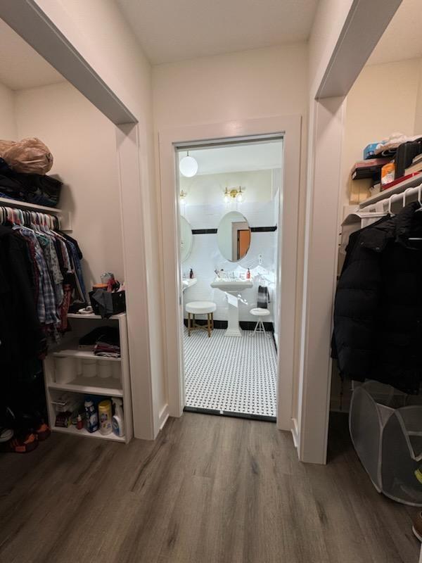 spacious closet with wood finished floors