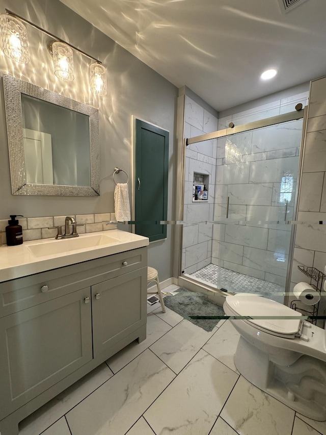 full bath featuring marble finish floor, vanity, toilet, and a shower stall