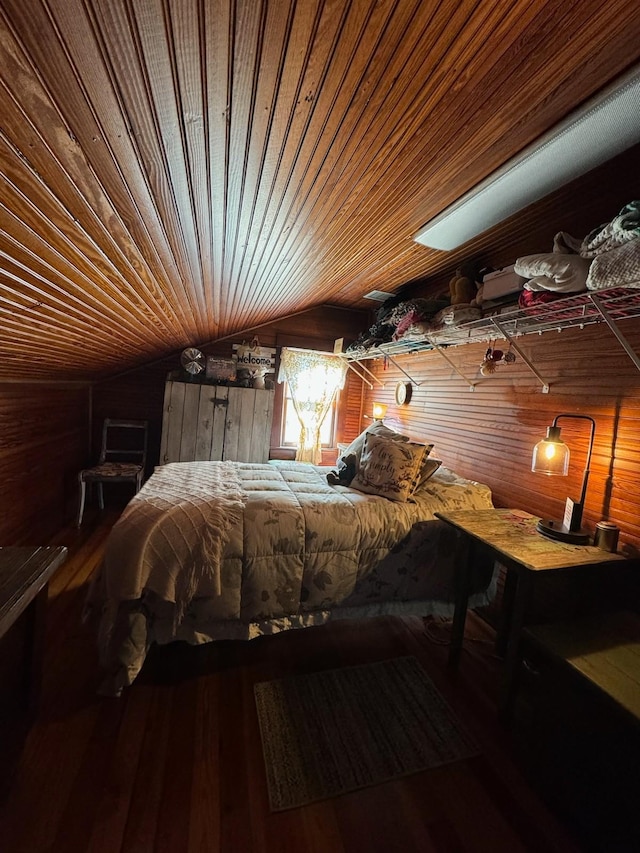 unfurnished bedroom with wood walls, wood ceiling, lofted ceiling, and wood finished floors