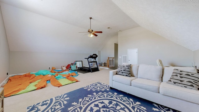 game room featuring carpet flooring, ceiling fan, a textured ceiling, and lofted ceiling