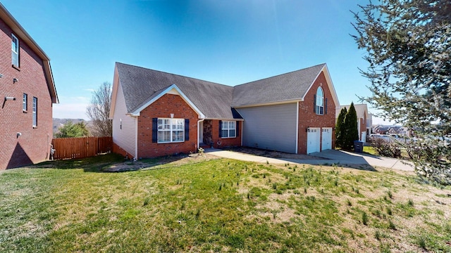 view of front of house with brick siding, concrete driveway, an attached garage, and fence