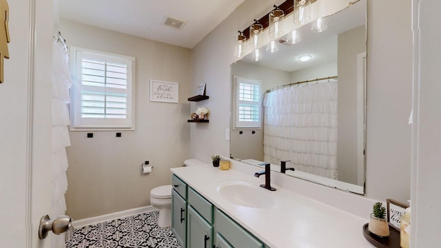 full bathroom featuring visible vents, toilet, tile patterned flooring, baseboards, and vanity