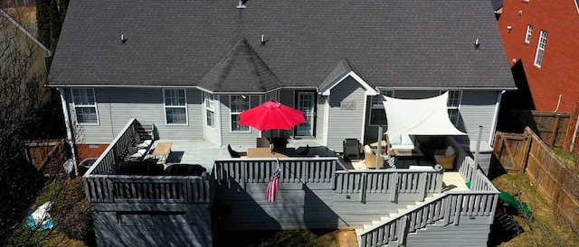 rear view of house featuring an outdoor living space, crawl space, a fenced backyard, and stairs