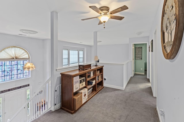 hall with carpet flooring and baseboards