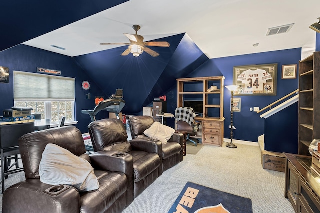 carpeted home theater featuring lofted ceiling, a ceiling fan, visible vents, and baseboards