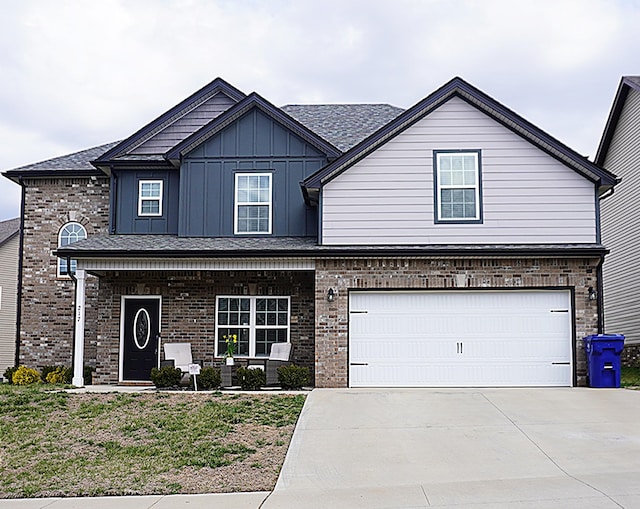 view of front of home with a garage, brick siding, board and batten siding, and driveway