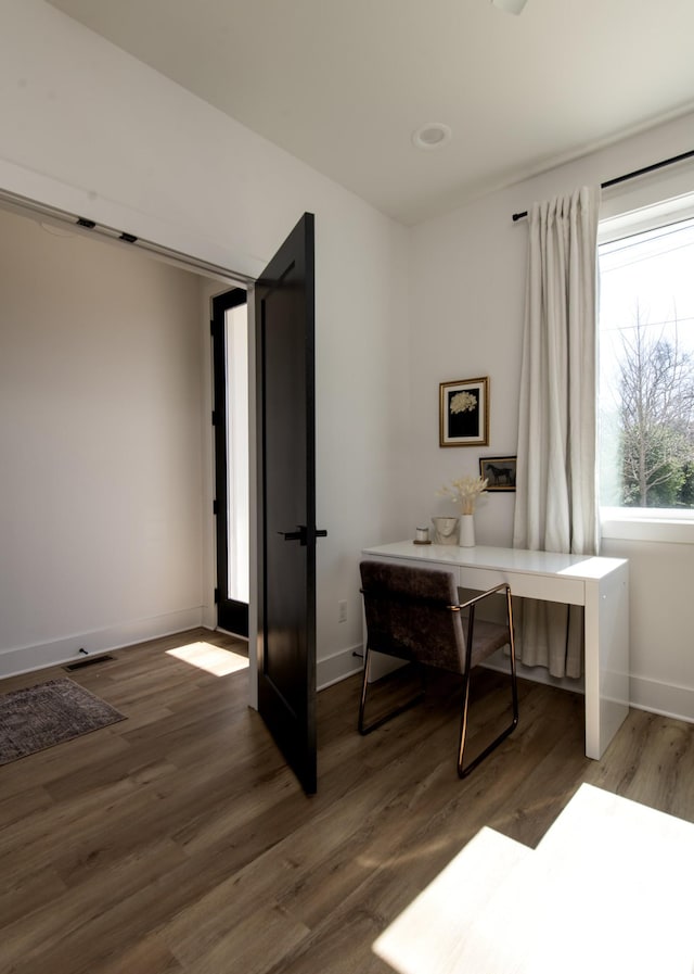 office area featuring wood finished floors and baseboards