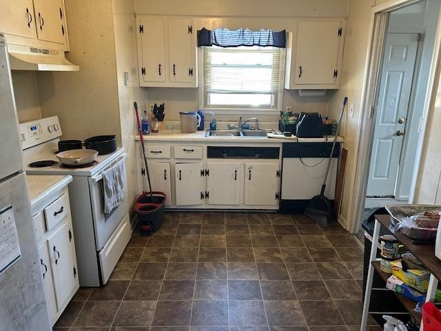 kitchen featuring under cabinet range hood, a sink, white cabinets, and white range with electric stovetop