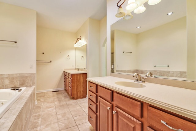 full bathroom featuring tile patterned flooring, a bath, two vanities, and a sink