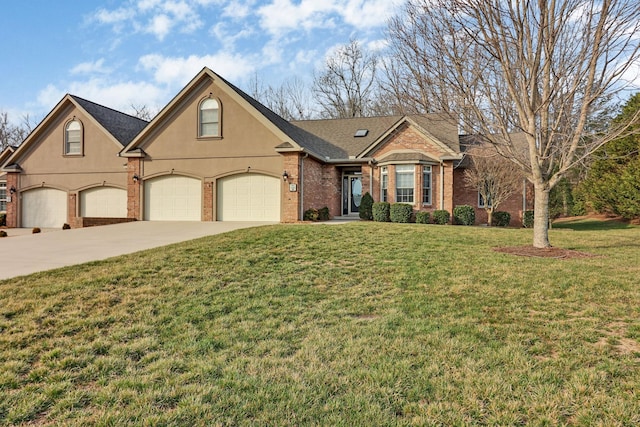 view of front of house with stucco siding, concrete driveway, a front yard, a garage, and brick siding