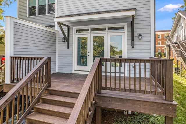 wooden deck featuring stairway and french doors