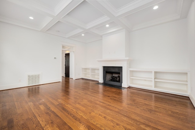 unfurnished living room with beam ceiling, a fireplace with flush hearth, wood finished floors, and visible vents