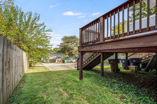 view of yard with stairway and fence