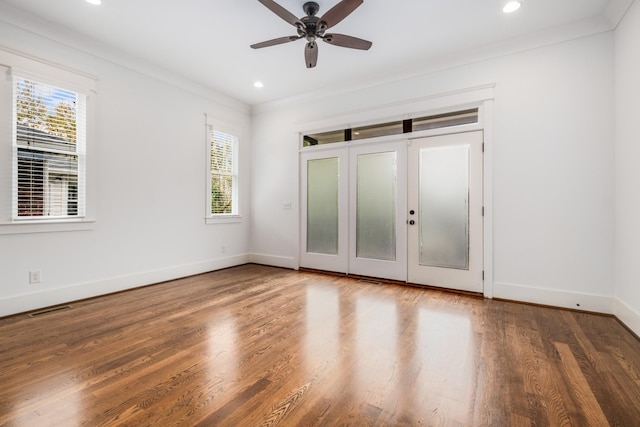 unfurnished bedroom featuring recessed lighting, baseboards, wood finished floors, and crown molding