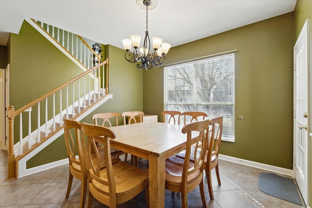 dining space with stairs, tile patterned floors, baseboards, and a chandelier