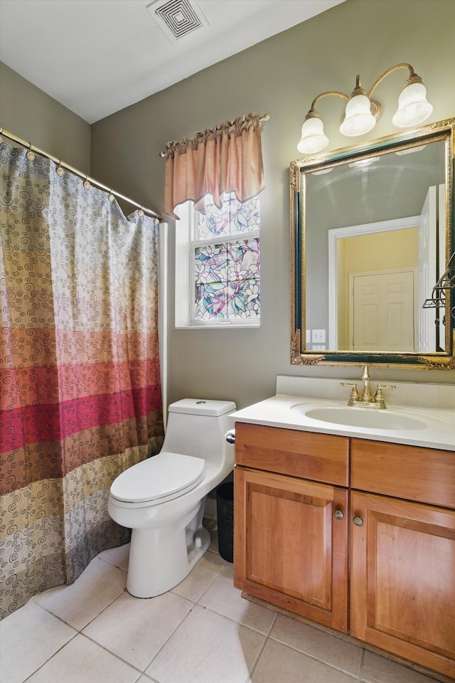 full bathroom featuring tile patterned floors, visible vents, toilet, and vanity