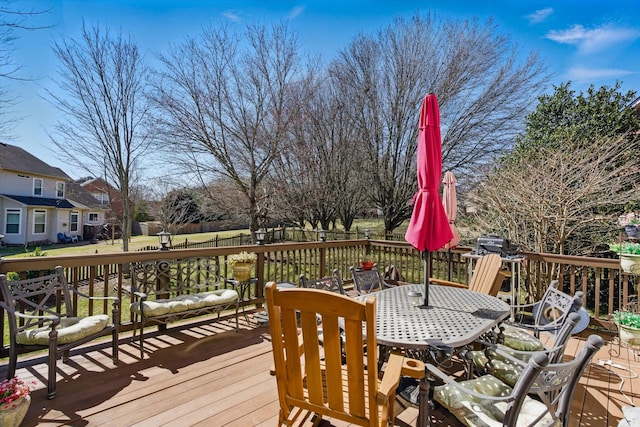 wooden deck with outdoor dining space