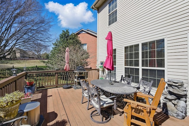 deck with outdoor dining space