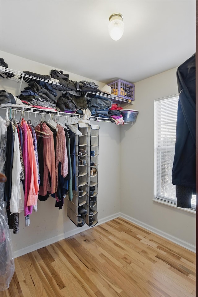 spacious closet with wood finished floors