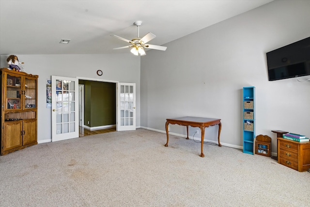 carpeted living room featuring lofted ceiling, french doors, baseboards, and ceiling fan