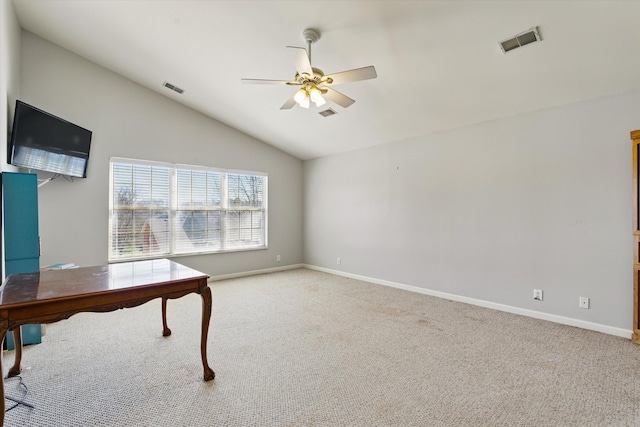 home office with visible vents, light colored carpet, lofted ceiling, and a ceiling fan