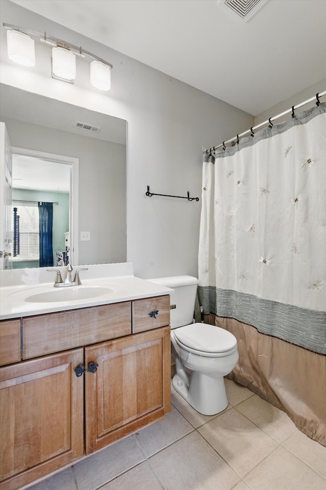 full bathroom featuring tile patterned floors, visible vents, toilet, and vanity